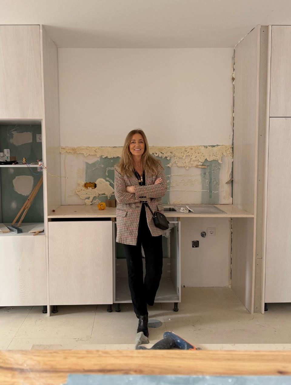 Architect Margarida Bugarim in the kitchen of an apartment renovated by her firm